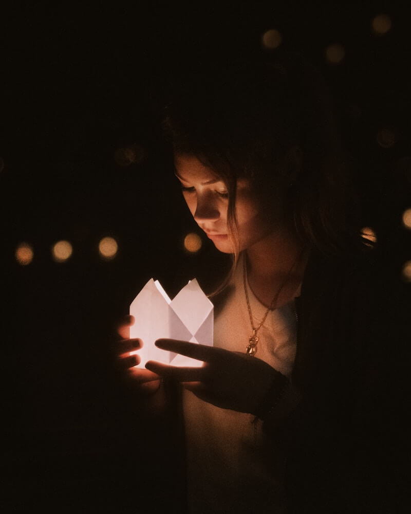 girl holding paper lantern