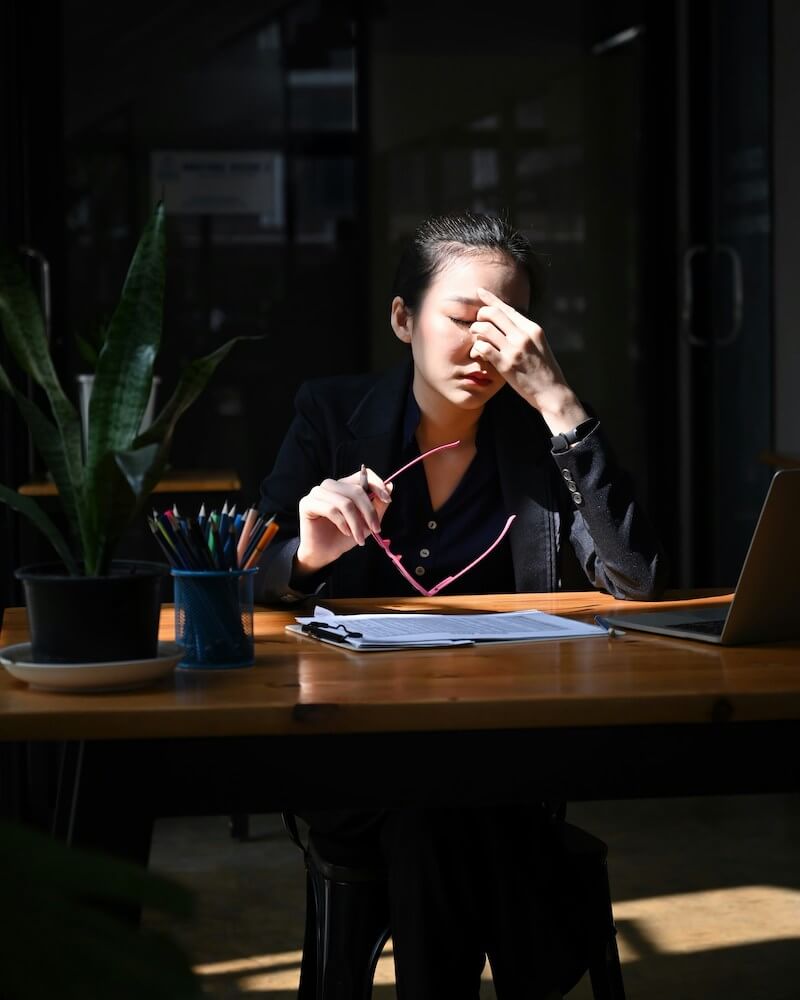 stressed woman at desk